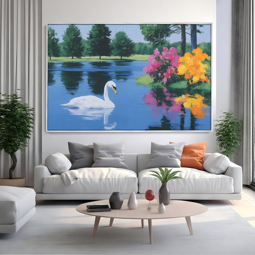 Tablou canvas cu pictura cu lebada pe lac si flori, in rama de aluminiu argintiu, pe perete intr-un living